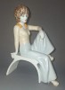 BIBELOU VINTAGE - FATA &Icirc;MBRĂCATĂ DUPĂ MODA ANILOR 70 AȘEZATĂ PE SCAUN (PORȚELAN ROM&Acirc;NESC ALBA IULIA)