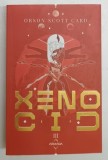 XENOCID , SERIA JOCUL LUI ENDER , PARTEA A III - A , EDITIA A V - A de ORSON SCOTT CARD , 2022 *LIPSA MIC FRAGMENT COPERTA SPATE