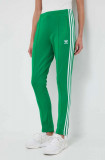 Cumpara ieftin Adidas Originals pantaloni de trening culoarea verde, cu imprimeu