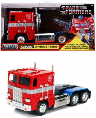 Masinuta metalica transformers g1 optimus prime scara 1 la 32 foto