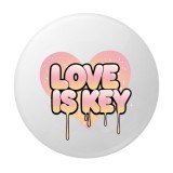 Cumpara ieftin Insigna rotunda Love is Key, 58 mm, design inima pastel cu efect drip, ac metalic