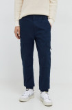 Cumpara ieftin Tommy Jeans pantaloni bărbați, culoarea bleumarin DM0DM18342