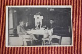 fotografie terasa cu un afis Regina Maria pe perete 1935