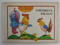 COCOSELUL PACALIT de MANFRD HINRICH , ilustratii de DAGMAR SCHWINTOWSKY , 1982 foto