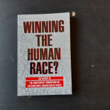 WINNING THE HUMAN RACE? - SADRUDDIN AGA KHAN (CARTE IN LIMBA ENGLEZA)