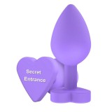 Plug anal TOYJOY Anal Play Booty Sweethearts, cu mesaj &bdquo;Secret Entrance&rdquo; pe baza &icirc;n formă de inimă, diametru 3.5 cm, mov