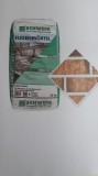 Mortar/chit (alb) pentru rosturi caramida aparenta.
