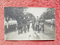 Fotografie tip carte postala, militari pe aleea unitatii, perioada interbelica