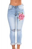 CL669-411 Jeans skinny cu floare brodate pe un picior