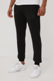 Cumpara ieftin Puma pantaloni de trening 534573 barbati, culoarea negru, neted