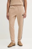 adidas pantaloni de trening Essentials culoarea bej, cu imprimeu, JX0712
