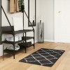 Covor pufos &quot;PAMPLONA&quot; cu fire &icirc;nalte, negru și crem, 60x110 cm