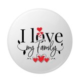 Cumpara ieftin Insigna rotunda I love my family 58 mm, model alb cu inimioare rosii si mesaj decorativ