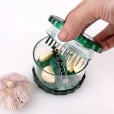 Cumpara ieftin Aparat pentru maruntit usturoi Garlic Twist