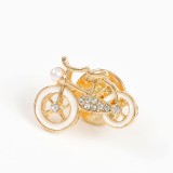 Brosa martisor bicicleta aurie cu roti albe