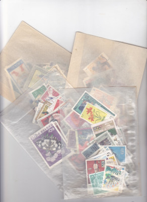 Plicuri filatelice cu timbre - 100 de timbre străine si Romanesti ștampilate foto
