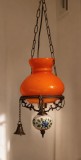 Lampa de tavan cu abajur din sticlă portocalie de tip opalină și corp din metal și ceramică cu motive florale albastre