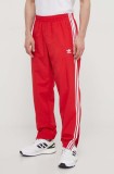 Cumpara ieftin Adidas Originals pantaloni de trening Adicolor Woven Firebird Track top culoarea roșu, cu imprimeu, IT2498