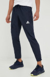 Cumpara ieftin Adidas pantaloni de trening barbati, culoarea albastru marin, neted