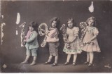 Carte postala colorata partial cu patru copii (scrisa 1912)