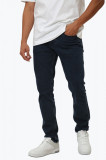 Cumpara ieftin Blugi barbati cu talie joasa si croiala slim fit bleumarin inchis, Calvin Klein Jeans