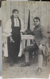 Fotografie tip carte postala, necirculata, militar si femeie in port popular, 1918