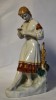 Statueta din portelan Polonne ZHK Ucraina URSS - Fata in port popular cu floare in mana - cca.1960