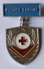 INSIGNA PIONIER SANITAR ALUMINIU VOPSIT 34/27 MM IMPRIMAREA PE VERSO TIP CUB IMPECABILA PIONIERI PIONERESC ( CITITI DESCRIEREA ), Romania de la 1950
