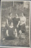 Fotografie tip Carte Postala, Patru femei si un caine, in curtea casei, perioada interbelica