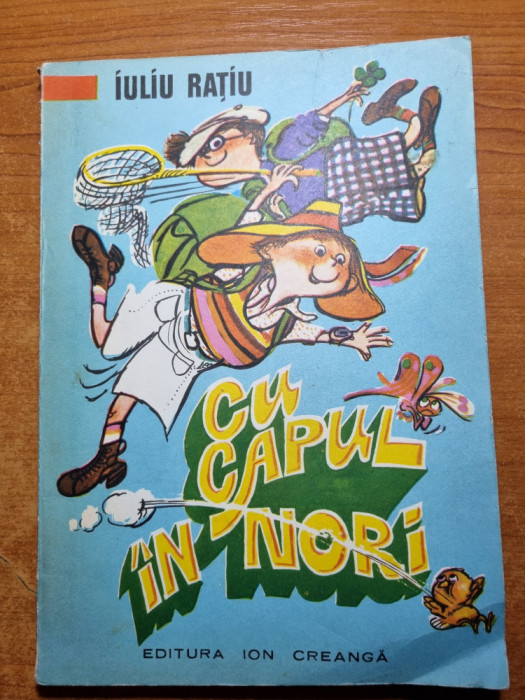 carte pentru copii - cu capul in nori - de iuliu ratiu - din anul 1977