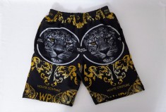 Pantaloni scur?i barba?i imprimeu leopard foto