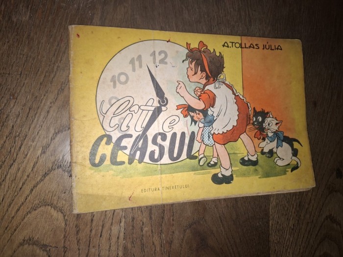 A. Tollas Julia - Cat e ceasul?