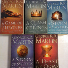 A SONG OF ICE AND FIRE (four volumes): A GAME OF THRONES / A CLASH OF KINGS / A STORM OF SWORDS / A FEAST FOR CROWS (in limba