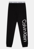Cumpara ieftin Pantaloni lungi de pijama Calvin Klein, unisex, 10 12 ani, 140 152 cm - OUTLET