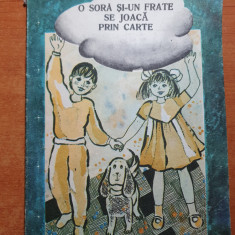 carte pentru copii - o sora si-un frate se joaca prin carte - din anul 1987