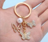 Breloc fluturi din aliaj cu pietricele si perla, auriu, un inel, 3*7 cm