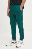 adidas pantaloni de trening Essentials culoarea verde, cu imprimeu, JD1879