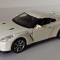 Macheta Nissan GT-R R35 alb/crem - Welly 1/36