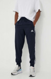 Adidas pantaloni de trening culoarea bleumarin, cu imprimeu IC0042