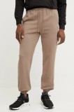 Puma pantaloni de trening din bumbac barbati, culoarea maro, neted, 631535