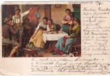Oameni in haine populare alpine adunati in jurul unei mese, intr-un interior de