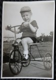 Fotografie, baietel pe tricicleta, perioada anilor 40-50