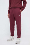 Reebok pantaloni de trening culoarea bordo, neted