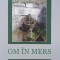 Om in mers - Olimpiu Nusfelean