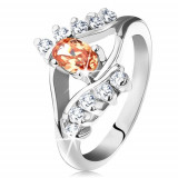 Inel de culoare argintie cu brațe despicate, zirconiu oval portocaliu, linii de zirconii transparente - Marime inel: 56