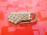 H478-Insigna veche stil Art Deco Cap de tanara femeie in alama aurita posibil pietricele din sticla stare buna. Lungime 6/2,5 cm.