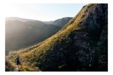 Tablou Canvas, "Explorator &icirc;n munții scăldați &icirc;n lumină", Scenic, Mountains, Sunrise, Valley, Wilderness, Solitude, Exploration, Nature, 39 x 26 cm, C