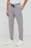 Cumpara ieftin Armani Exchange pantaloni de trening barbati, culoarea gri, neted