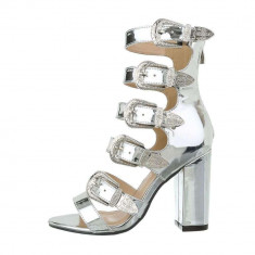 Sandale moderne, argintii, inalte pe picior foto