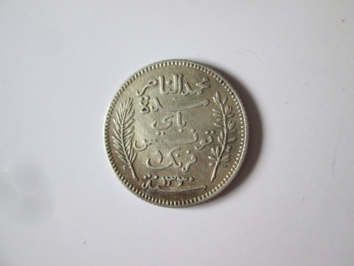 Rară! Tunisia 1 Franc 1912(an rar) argint,moneda din imagini in stare f.buna cu patina frumoasa,diam=23 mm,greutate=5 grame